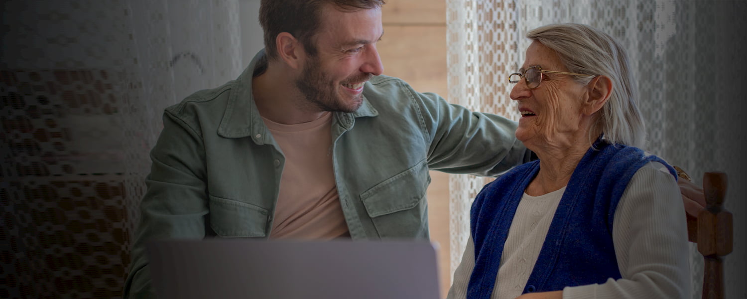 Older lady and younger man laughing